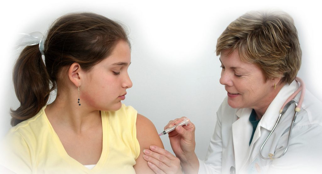 Nurse vaccinating a child